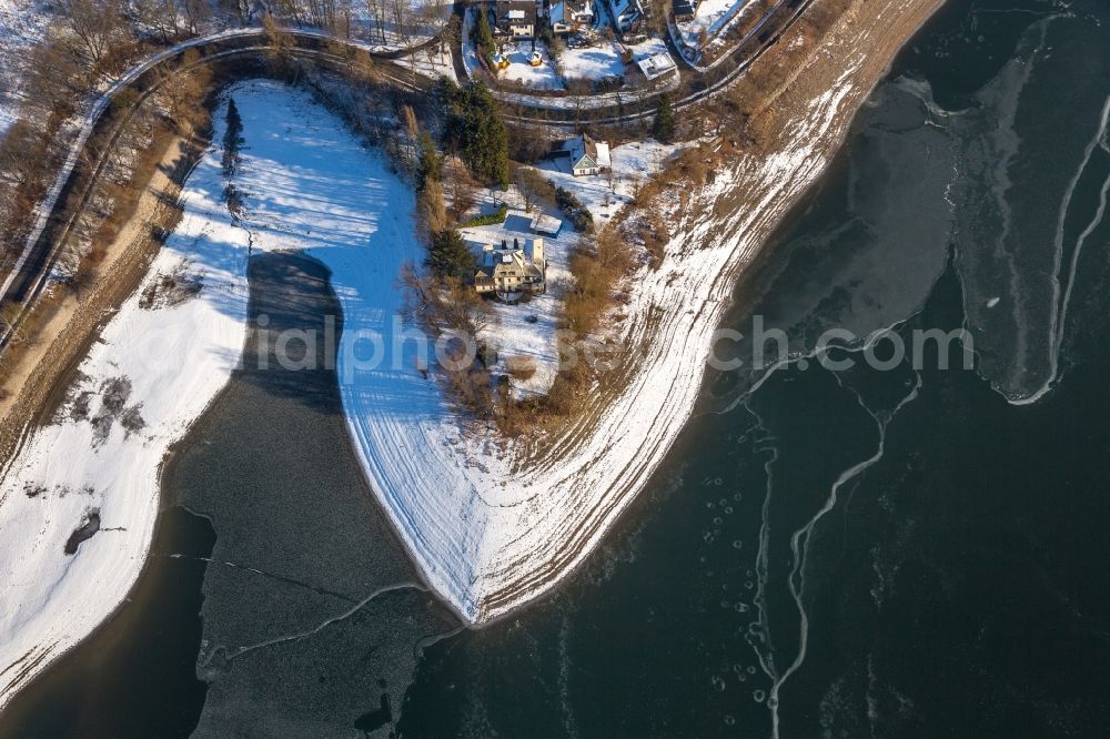 Delecke from above - Wintry snowy Riparian areas on the lake area of Moehnesee in Delecke in the state North Rhine-Westphalia