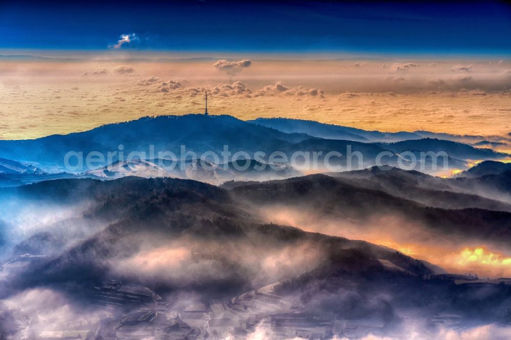 Vogtsburg im Kaiserstuhl from above - Wintry snowy forest and mountain landscape at Kaiserstuhl in Vogtsburg im Kaiserstuhl in the federal state of Baden-Wuerttemberg, Germany