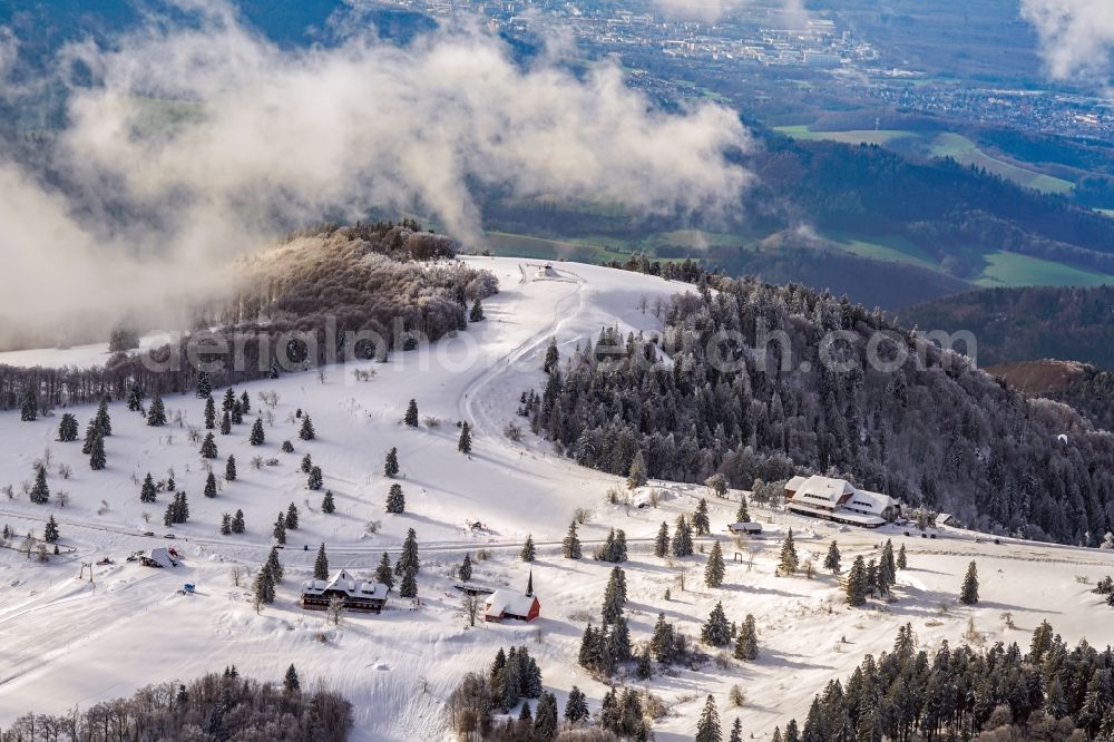 Aerial photograph Waldkirch - Wintry snowy forest and mountain scenery on Kandel on Schwarzwald in Waldkirch in the state Baden-Wurttemberg, Germany