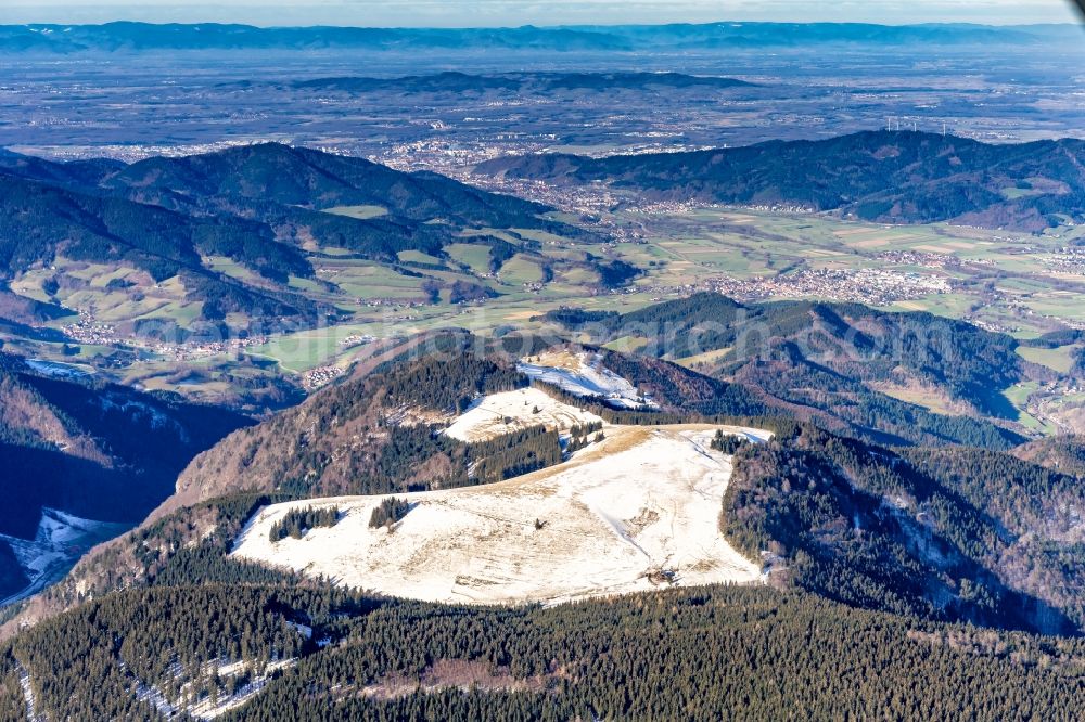 Waldkirch from the bird's eye view: Wintry snowy forest and mountain scenery on Kandel on Schwarzwald in Waldkirch in the state Baden-Wurttemberg, Germany