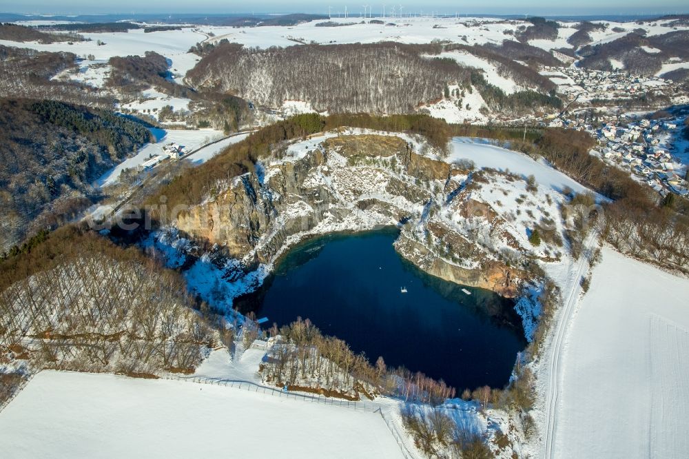 Brilon from above - Wintry snowy woodland in the lake in the mountain / Messinghausener lake in Brilon in the federal state North Rhine-Westphalia