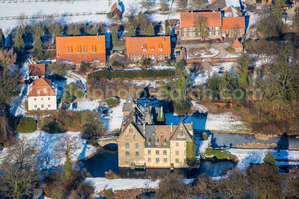 Aerial photograph Neheim - Wintry snowy building and castle park systems of water castle Hoellinghofen in Neheim in the state North Rhine-Westphalia