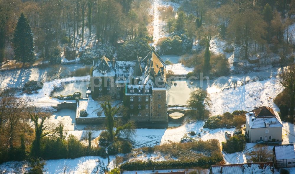 Aerial image Neheim - Wintry snowy building and castle park systems of water castle Hoellinghofen in Neheim in the state North Rhine-Westphalia