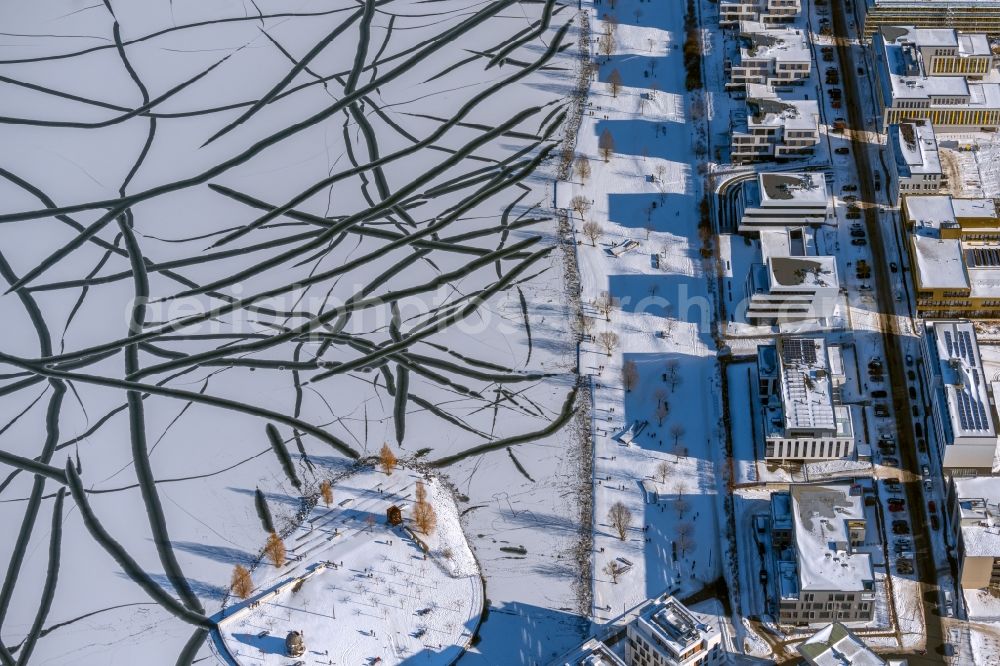 Aerial photograph Dortmund - Wintry snowy traces on the frozen and ice-covered water surface Phoenix-See in the district Hoerde in Dortmund at Ruhrgebiet in the state North Rhine-Westphalia, Germany