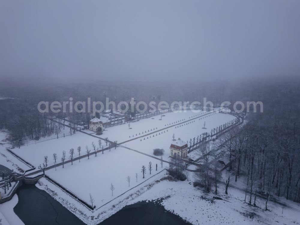 Moritzburg from above - Wintry snowy building and castle park systems of water- and huntig-castle on street Schlossallee in Moritzburg in the state Saxony, Germany