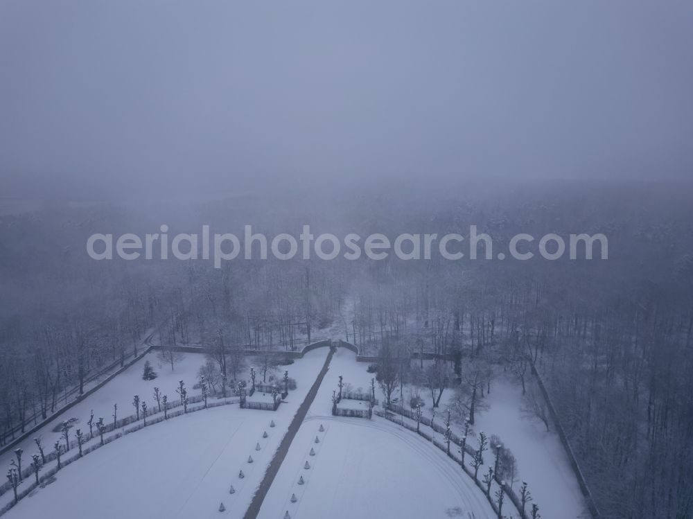 Moritzburg from the bird's eye view: Wintry snowy building and castle park systems of water- and huntig-castle on street Schlossallee in Moritzburg in the state Saxony, Germany