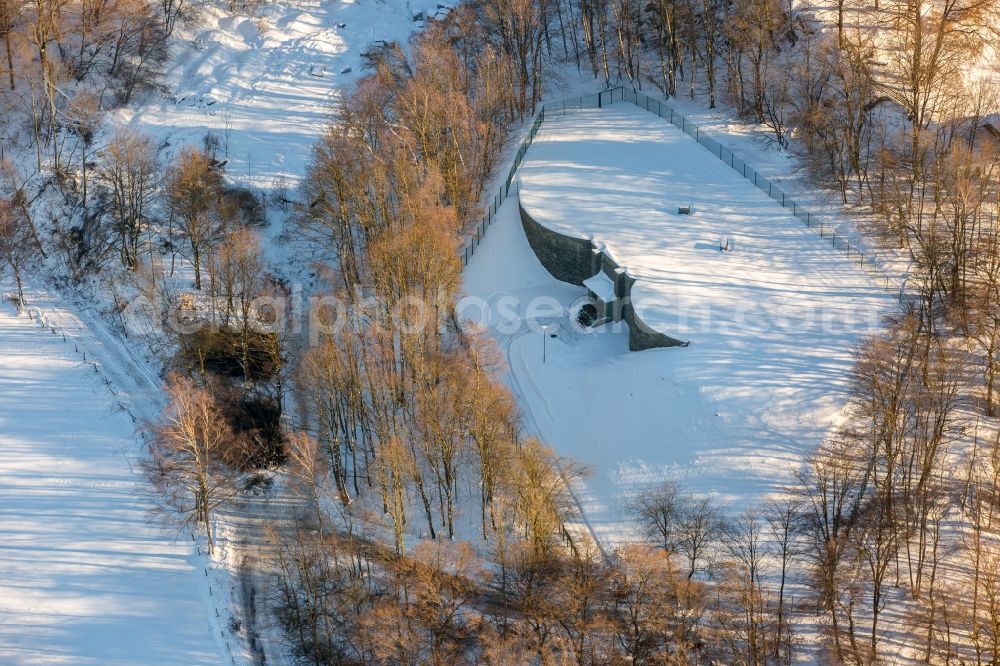 Brilon from above - Wintry snowy Structure of the waterworks with high storage facility in Brilon in the state North Rhine-Westphalia