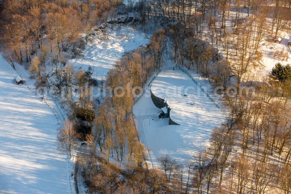 Brilon from the bird's eye view: Wintry snowy Structure of the waterworks with high storage facility in Brilon in the state North Rhine-Westphalia