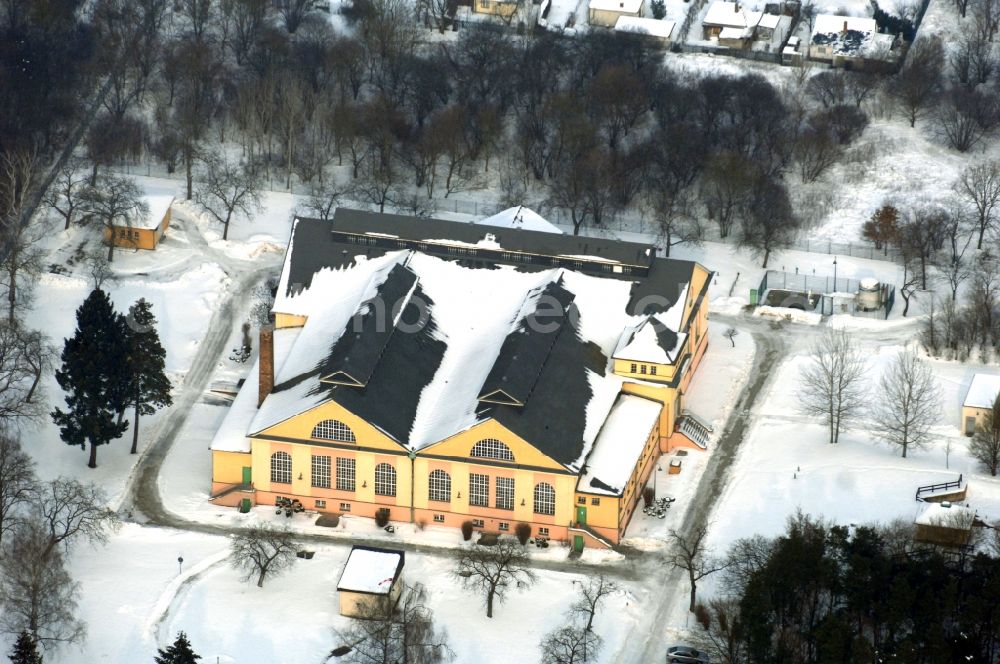 Berlin from the bird's eye view: Wintry snowy structure of the waterworks with high storage facility in the district Kaulsdorf in Berlin, Germany