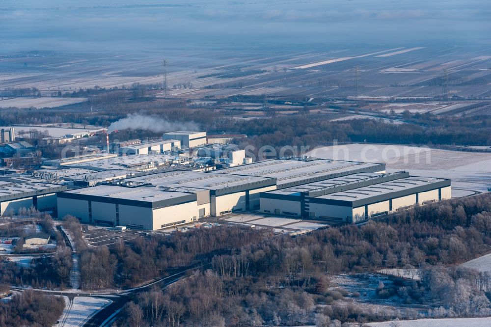 Stade from the bird's eye view: Wintry snowy building and production halls on the premises of Airbus Operations GmbH on Airbus-Strasse in Stade in the state Lower Saxony, Germany