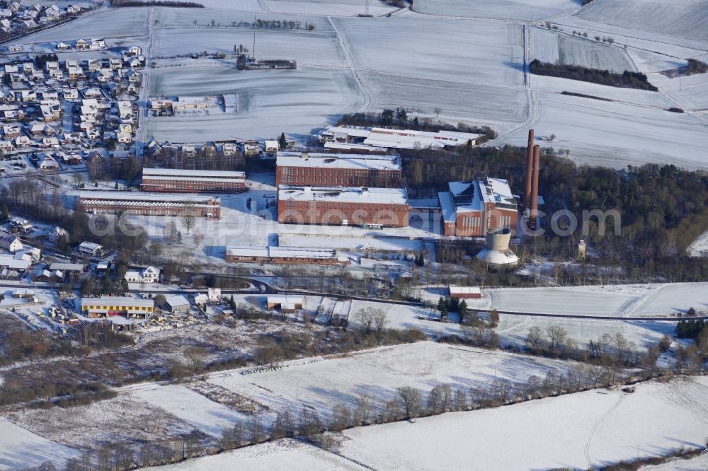 Rhumspringe from above - Wintry snowy plant site of the old factory Schickert-Werk in Rhumspringe in the state Lower Saxony, Germany