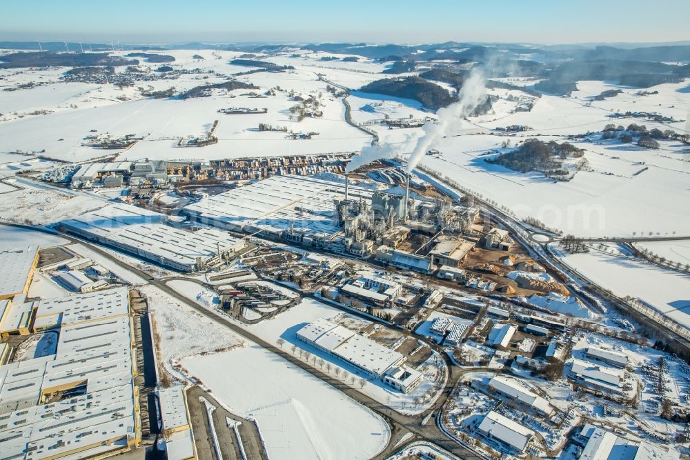 Brilon from the bird's eye view: Wintry snowy Building and production halls on the premises of Egger Holzwerkstoffe Brilon GmbH & Co. KG in Brilon in the state North Rhine-Westphalia