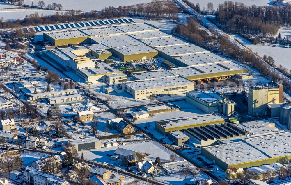 Aerial image Werl - Wintry snowy building and production halls on the premises of KETTLER Holding GmbH Zur Mersch in the district Westoennen in Werl at Ruhrgebiet in the state North Rhine-Westphalia, Germany