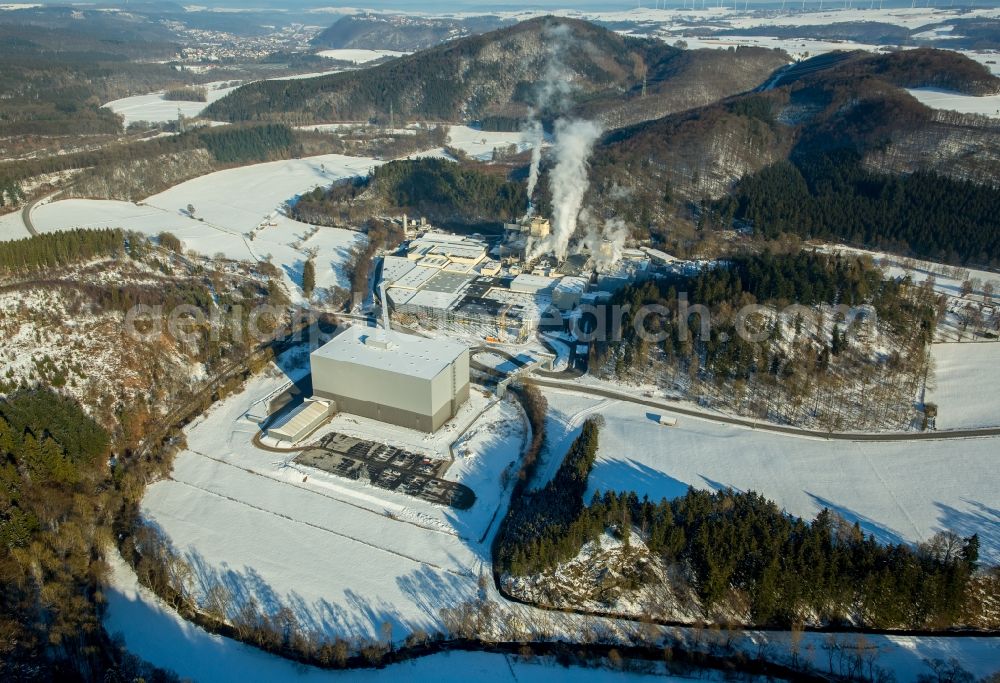 Marsberg from the bird's eye view: Wintry snowy building and production halls on the premises of WEPA Papierfabrik Krengel P. GmbH & Co. KG, Zw.Werk Unterm Klausknapp in the district Giershagen in Marsberg in the state North Rhine-Westphalia