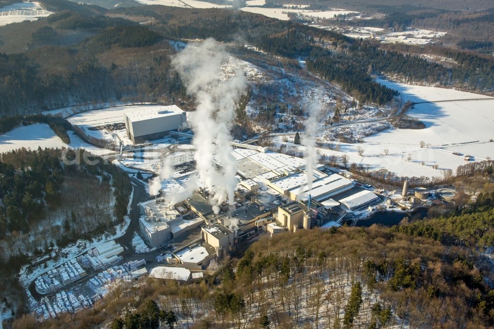 Aerial photograph Marsberg - Wintry snowy building and production halls on the premises of WEPA Papierfabrik Krengel P. GmbH & Co. KG, Zw.Werk Unterm Klausknapp in the district Giershagen in Marsberg in the state North Rhine-Westphalia