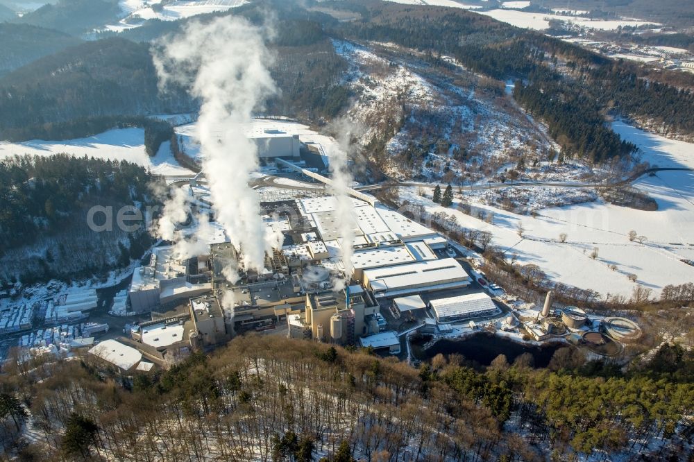 Marsberg from above - Wintry snowy building and production halls on the premises of WEPA Papierfabrik Krengel P. GmbH & Co. KG, Zw.Werk Unterm Klausknapp in the district Giershagen in Marsberg in the state North Rhine-Westphalia