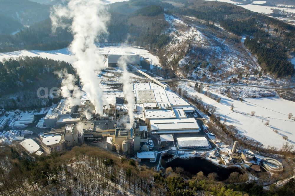 Marsberg from the bird's eye view: Wintry snowy building and production halls on the premises of WEPA Papierfabrik Krengel P. GmbH & Co. KG, Zw.Werk Unterm Klausknapp in the district Giershagen in Marsberg in the state North Rhine-Westphalia