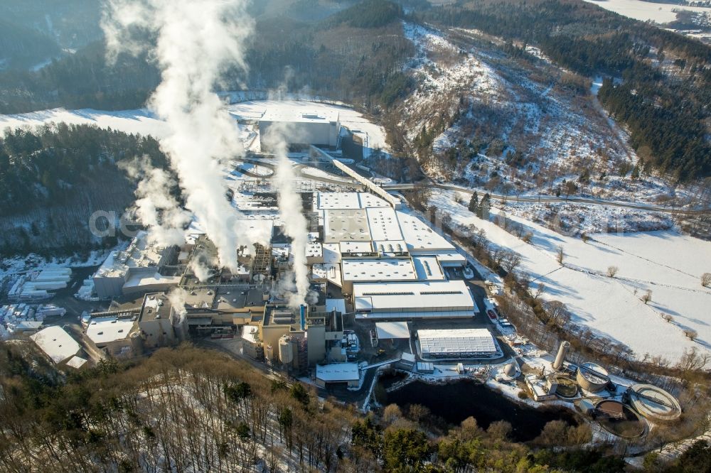 Aerial image Marsberg - Wintry snowy building and production halls on the premises of WEPA Papierfabrik Krengel P. GmbH & Co. KG, Zw.Werk Unterm Klausknapp in the district Giershagen in Marsberg in the state North Rhine-Westphalia