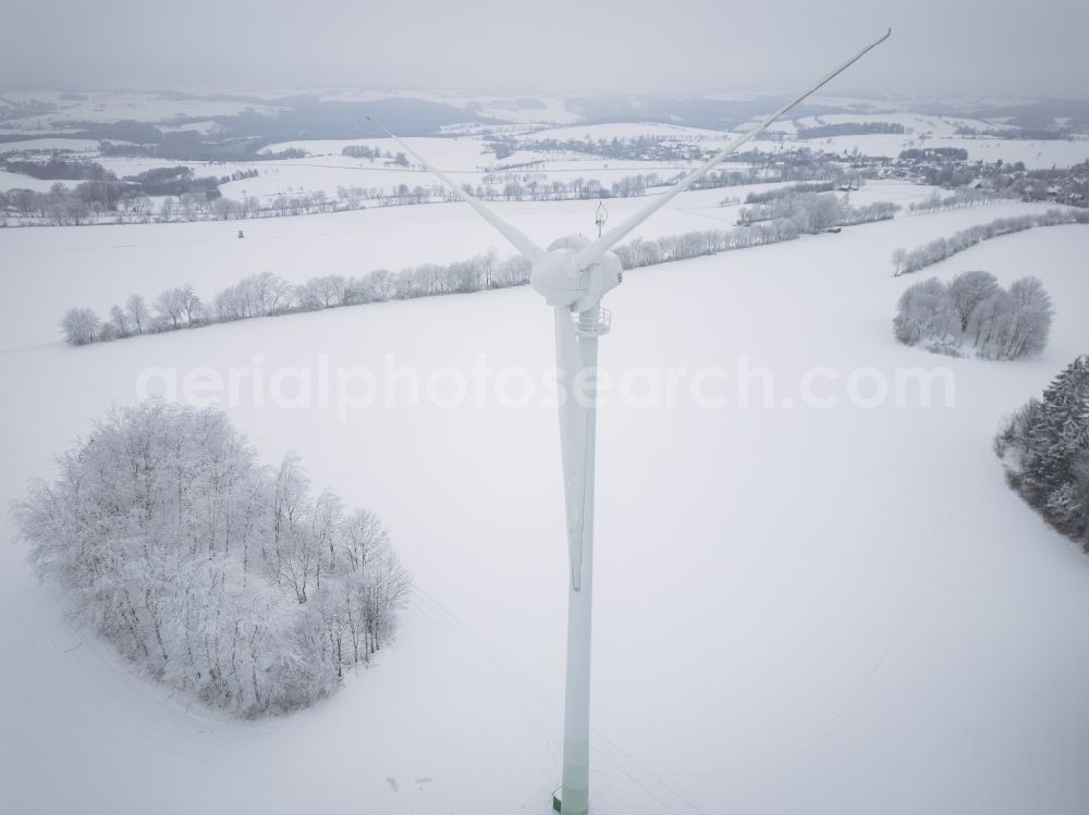 Wolkenstein from the bird's eye view: Wintry snowy agricultural land and fields with wind turbines in Wolkenstein in the state Saxony, Germany