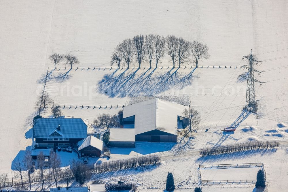 Aerial photograph Dortmund - Wintry snowy residential and commercial building of Transportdienstes Krankenfahrten A&M Lange GbR in the district Soelde in Dortmund at Ruhrgebiet in the state North Rhine-Westphalia, Germany