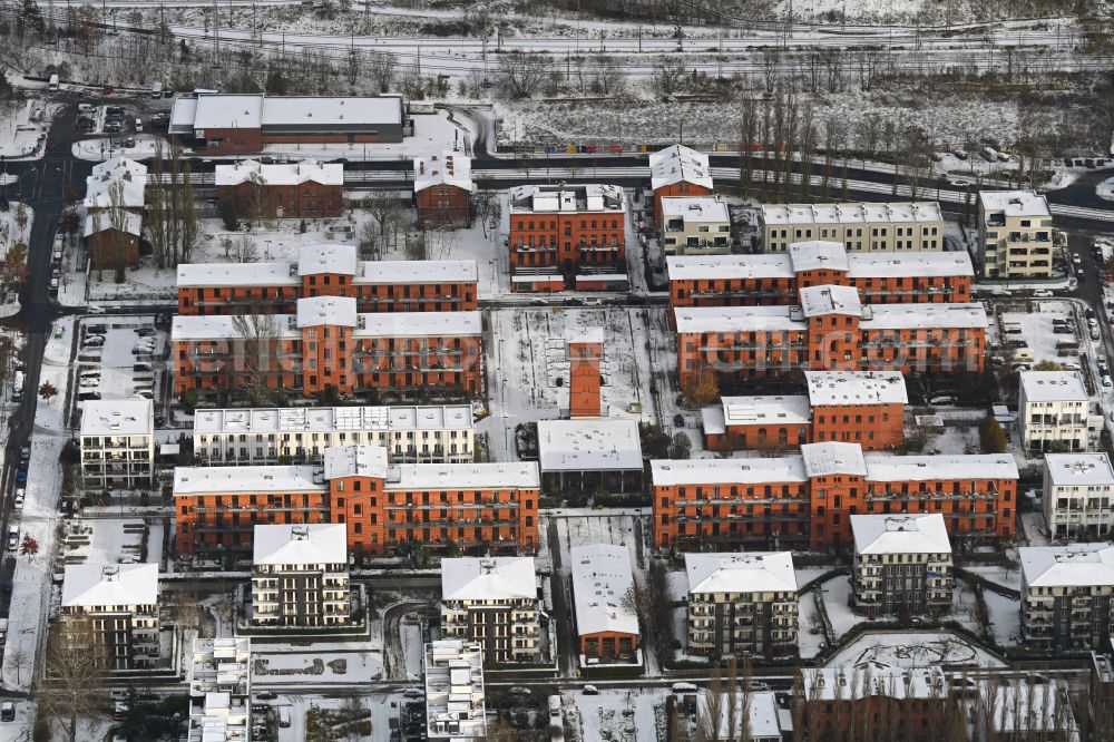 Berlin from above - Wintry snowy residential area of the multi-family housing estate along Karl-Wilker-Strasse - Friedrich-Jacobs-Promenade in the district of Rummelsburg in Berlin, Germany