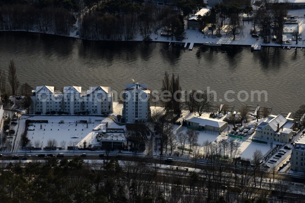 Berlin from above - Wintry snowy residential area of the multi-family house settlement on Spree- river - An der Wuhlheide in the district Oberschoeneweide in Berlin