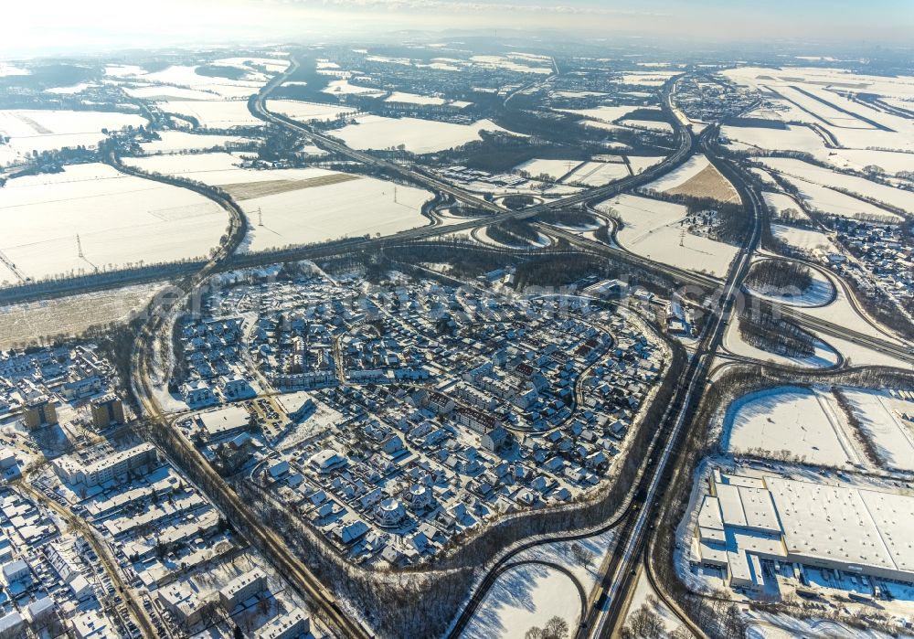 Unna from the bird's eye view: Wintry snowy settlement between of Bandesstrasse B1 and of Autobahn A44 in Unna in the state North Rhine-Westphalia, Germany