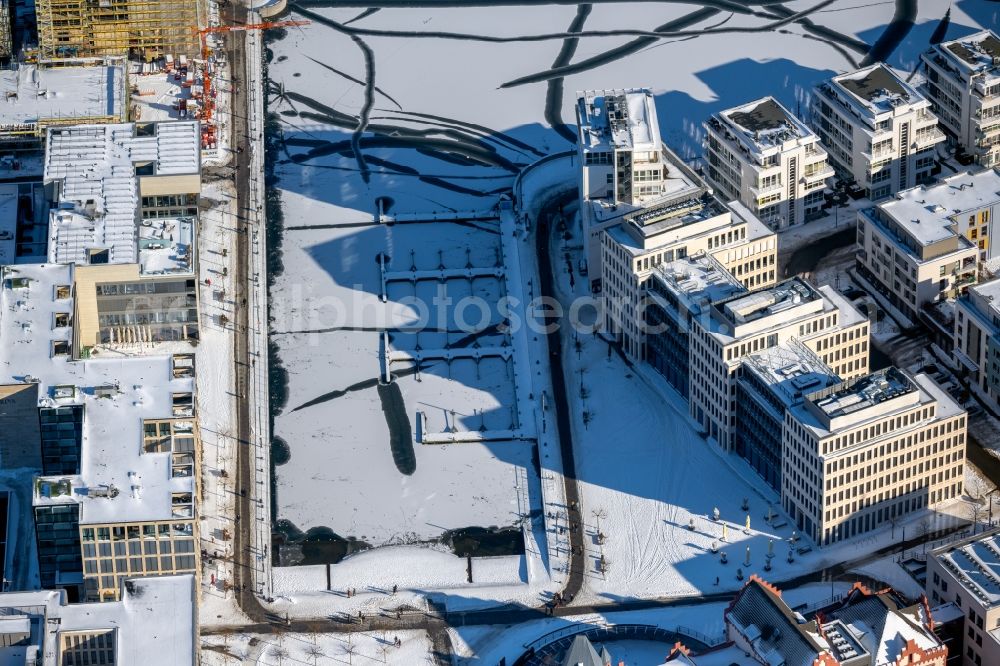 Aerial image Dortmund - Wintry snowy pleasure boat marina with docks and moorings on the shore area of Phoenix See in Dortmund in the state North Rhine-Westphalia