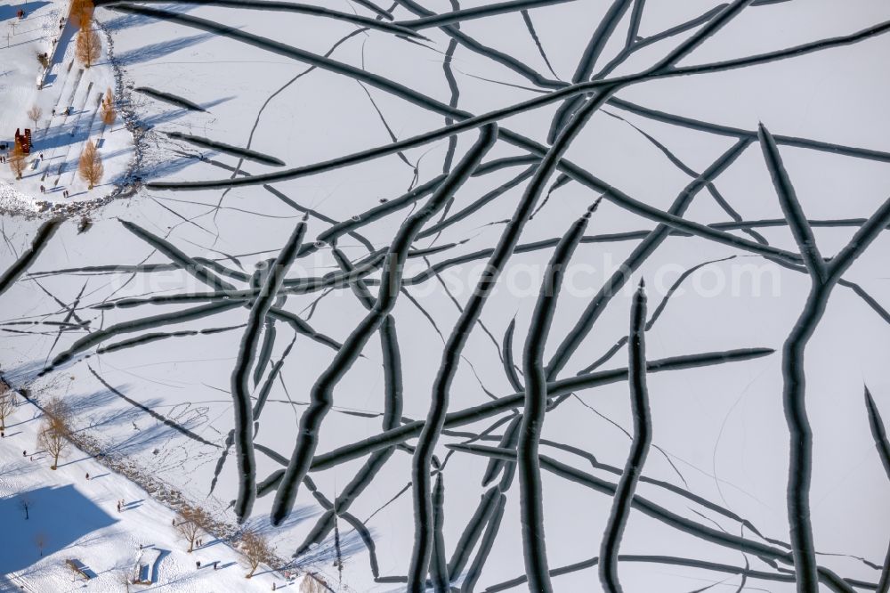 Aerial image Dortmund - Wintry snow-covered shore areas of the frozen Phoenix See in the district of Hoerde in Dortmund in the Ruhr area in the state of North Rhine-Westphalia, Germany