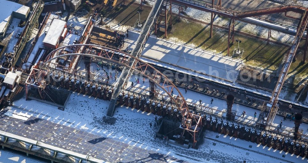 Essen from the bird's eye view: Winter walk on the ice rink in the coking plant Zeche Zollverein in Essen in North Rhine-Westphalia