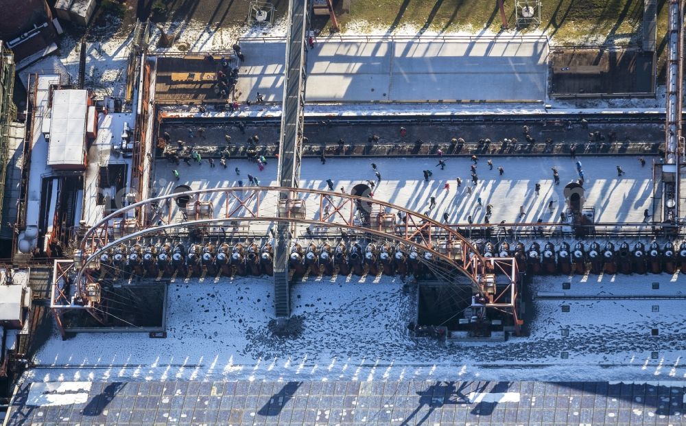 Aerial image Essen - Winter walk on the ice rink in the coking plant Zeche Zollverein in Essen in North Rhine-Westphalia