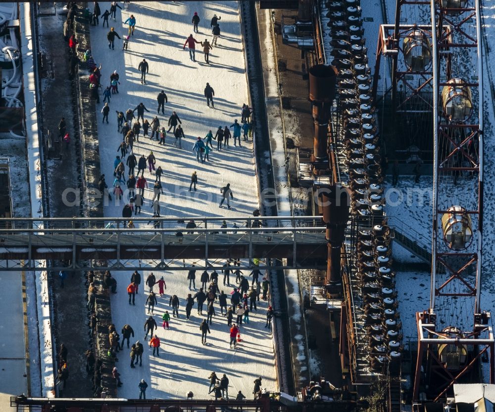 Essen from above - Winter walk on the ice rink in the coking plant Zeche Zollverein in Essen in North Rhine-Westphalia