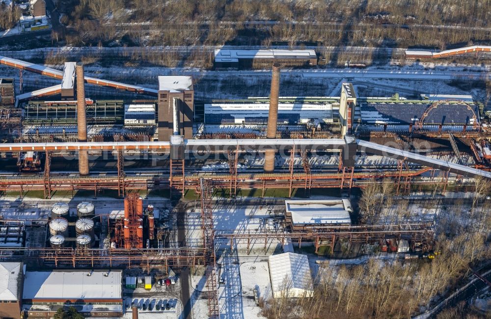 Essen from the bird's eye view: Winter walk on the ice rink in the coking plant Zeche Zollverein in Essen in North Rhine-Westphalia