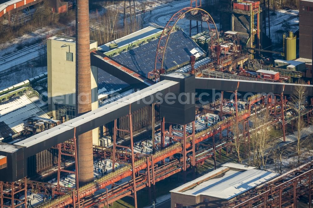 Essen from the bird's eye view: Winter walk on the ice rink in the coking plant Zeche Zollverein in Essen in North Rhine-Westphalia