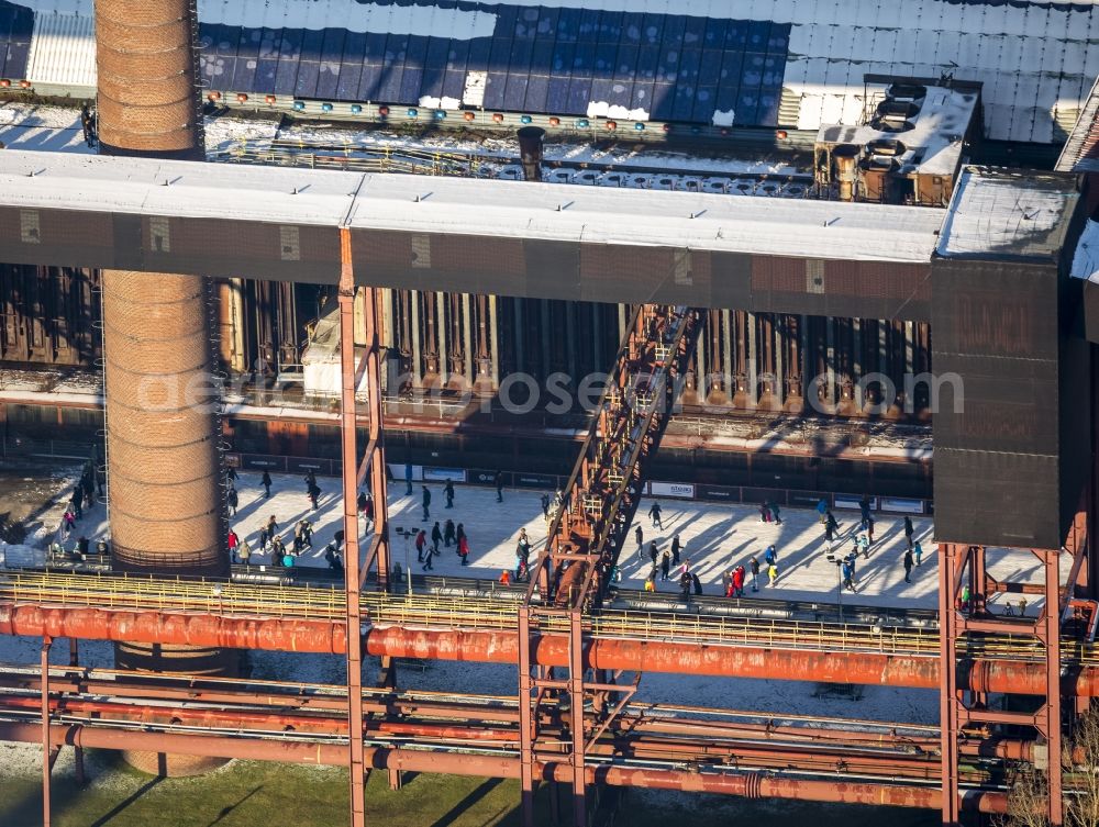 Essen from above - Winter walk on the ice rink in the coking plant Zeche Zollverein in Essen in North Rhine-Westphalia