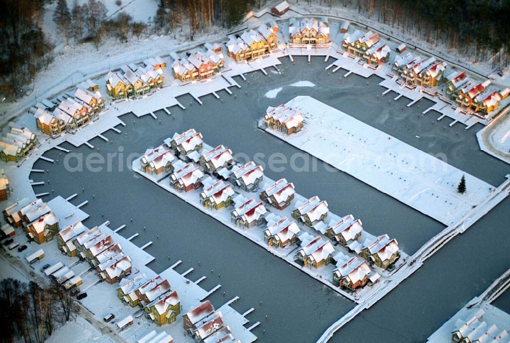 Rheinsberg from the bird's eye view: / Brandenburg Winterstimmung am fast fertigen Hafendorf Rheinsberg - Projektgesellschaft Hafendorf Rheinsberg GmbH,Lenaustr. 27,D-12305 Berlin,Telefon: +49 33931/34 161,Telefax: +49 33931/34 163,Email: info@hafendorf-rheinsberg.de,Achim Walder: