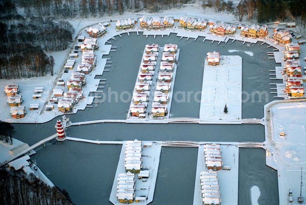 Aerial photograph Rheinsberg - / Brandenburg Winterstimmung am fast fertigen Hafendorf Rheinsberg - Projektgesellschaft Hafendorf Rheinsberg GmbH,Lenaustr. 27,D-12305 Berlin,Telefon: +49 33931/34 161,Telefax: +49 33931/34 163,Email: info@hafendorf-rheinsberg.de,Achim Walder: