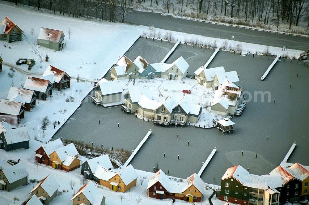 Rheinsberg from the bird's eye view: / Brandenburg Winterstimmung am fast fertigen Hafendorf Rheinsberg - Projektgesellschaft Hafendorf Rheinsberg GmbH,Lenaustr. 27,D-12305 Berlin,Telefon: +49 33931/34 161,Telefax: +49 33931/34 163,Email: info@hafendorf-rheinsberg.de,Achim Walder: