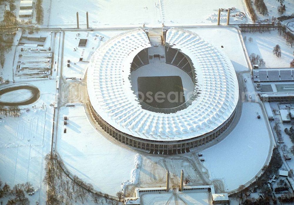 Aerial photograph Berlin - Winterstimmung am Berliner Olympiastadion -Olympiastadion Berlin GmbH,Olympischer Platz 3,14053 Berlin,Tel.: +49 (0)30 306 88 100, Architekten: gmp Gerkan, Marg & Partner Hamburg. Werbliche Nutzungs nur nach vorheriger Absprache !.