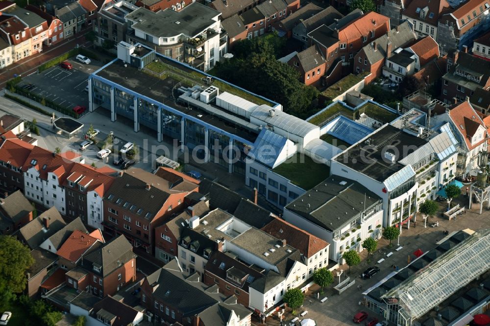 Aurich from the bird's eye view: Residential and commercial building at the market with the Sparkasse main office in Aurich in the state Lower Saxony