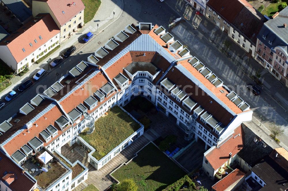 Strausberg from the bird's eye view: Residential and commercial new construction house at Breite Strasse in Strausberg in Brandenburg