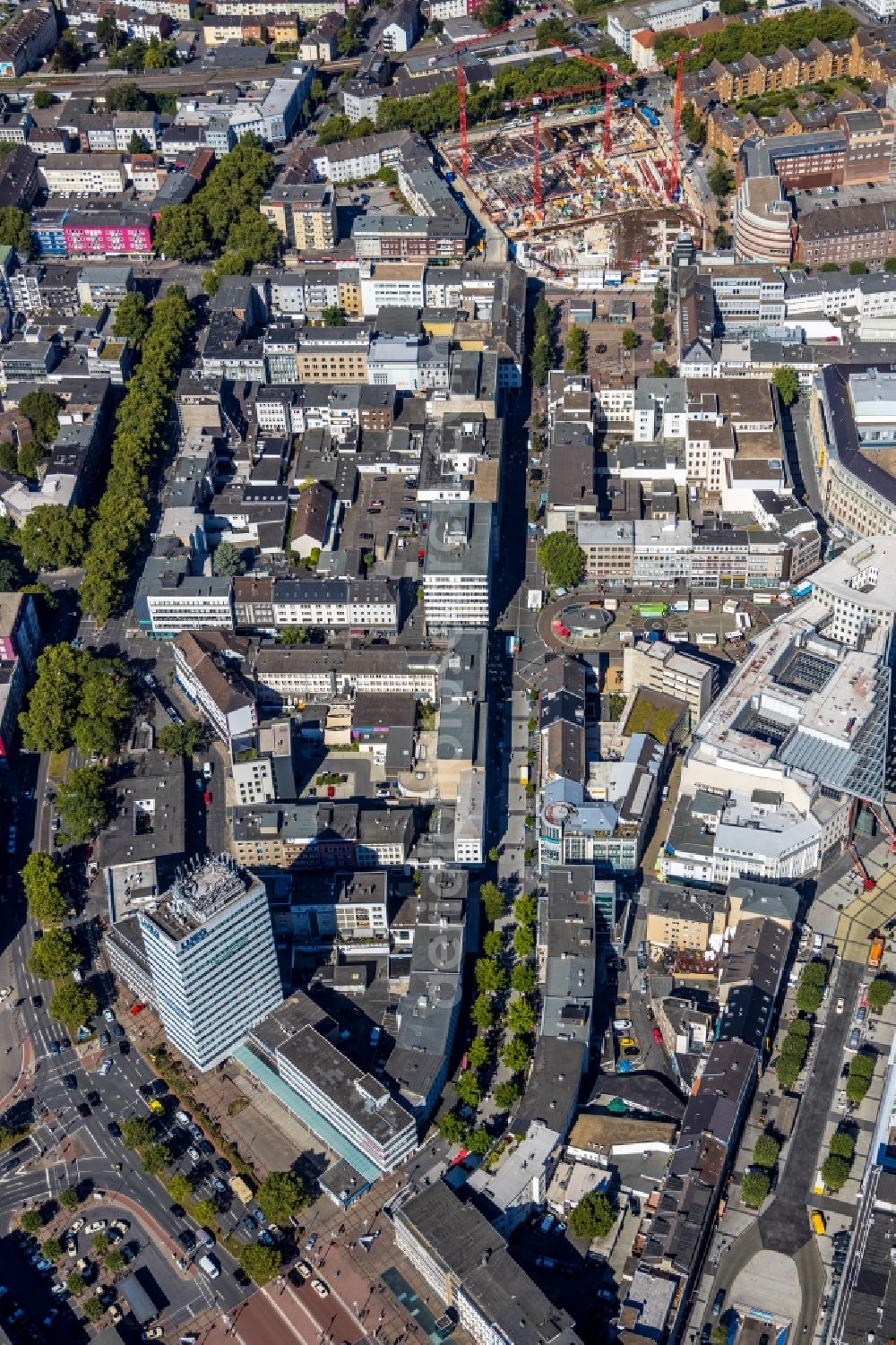 Bochum from the bird's eye view: Residential and commercial building district along the Huestrasse - Hellweg - Husemannplatz - Dr.-Ruer-Platz overlooking the Europahaus in Bochum in the state North Rhine-Westphalia, Germany. The Europahaus was designed by the architect Roman Reiser from 1959 and built from 1961 to 1962