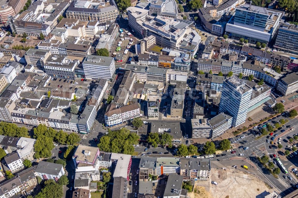 Bochum from the bird's eye view: Residential and commercial building district along the Huestrasse - Hellweg - Husemannplatz - Dr.-Ruer-Platz overlooking the Europahaus in Bochum in the state North Rhine-Westphalia, Germany. The Europahaus was designed by the architect Roman Reiser from 1959 and built from 1961 to 1962