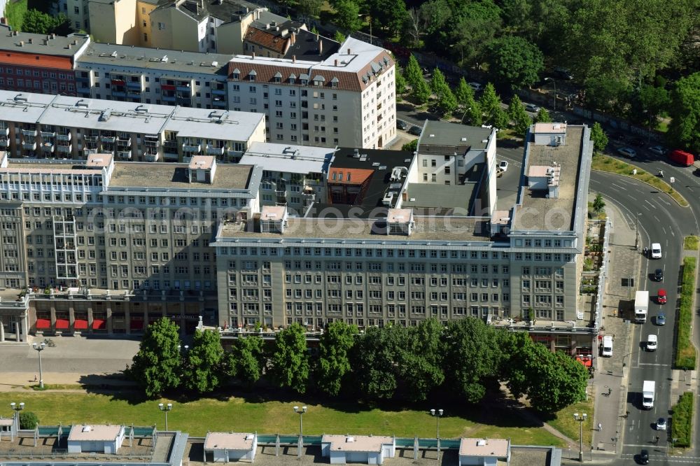 Aerial image Berlin - Residential and commercial building district along of Karl-Marx-Allee corner Strasse of Pariser Kommune in the district Friedrichshain-Kreuzberg in Berlin, Germany