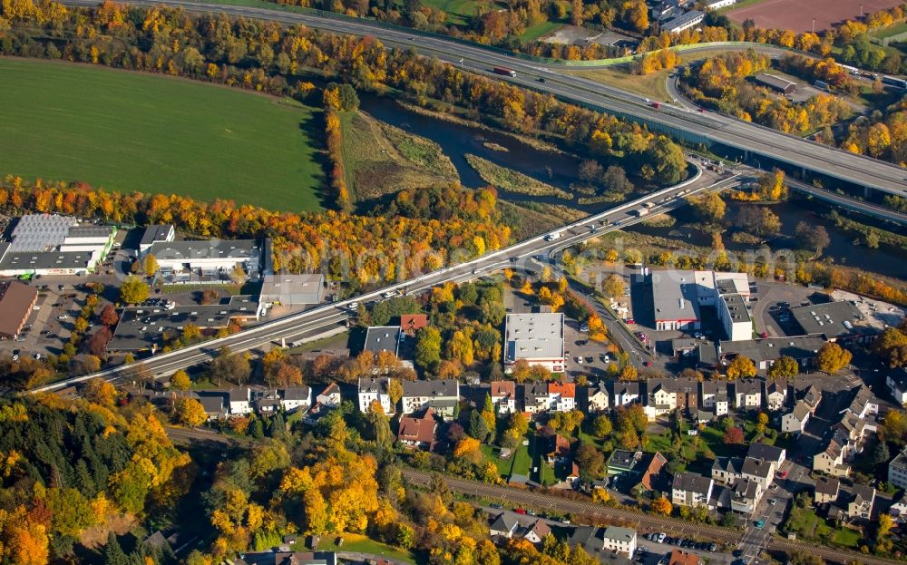 Aerial photograph Neheim - Residential and commercial area at the highway exit 62 Neheim of the motorway A 46 in Neheim in the state of North Rhine-Westphalia