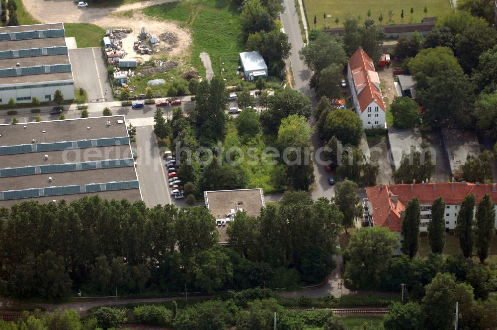 Berlin from the bird's eye view: Blick auf das Wohn- und Industriegebiet an der Bahntrasse Niederschöneweide im Bereich der Landfliegerstrasse, Pilotenstraße, Hagedornstraße und Groß-Berliner Damm. Eine Immobilie der HVB Immobilien AG