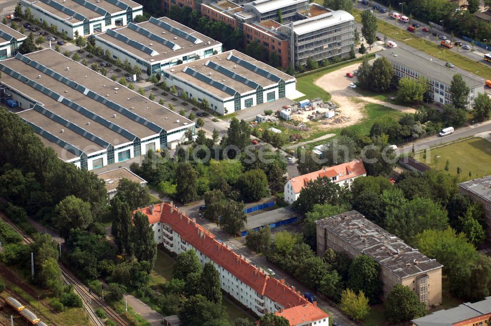 Aerial photograph Berlin - Blick auf das Wohn- und Industriegebiet an der Bahntrasse Niederschöneweide im Bereich der Landfliegerstrasse, Pilotenstraße, Hagedornstraße und Groß-Berliner Damm. Eine Immobilie der HVB Immobilien AG