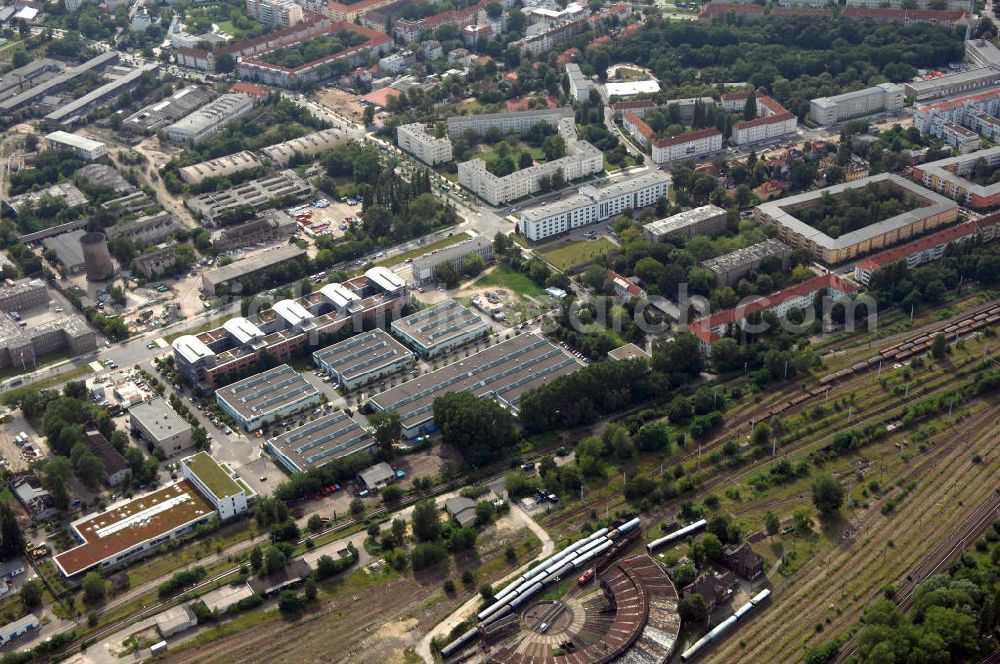 Aerial photograph Berlin - Blick auf das Wohn- und Industriegebiet an der Bahntrasse Niederschöneweide im Bereich der Landfliegerstrasse, Pilotenstraße, Hagedornstraße und Groß-Berliner Damm. Eine Immobilie der HVB Immobilien AG