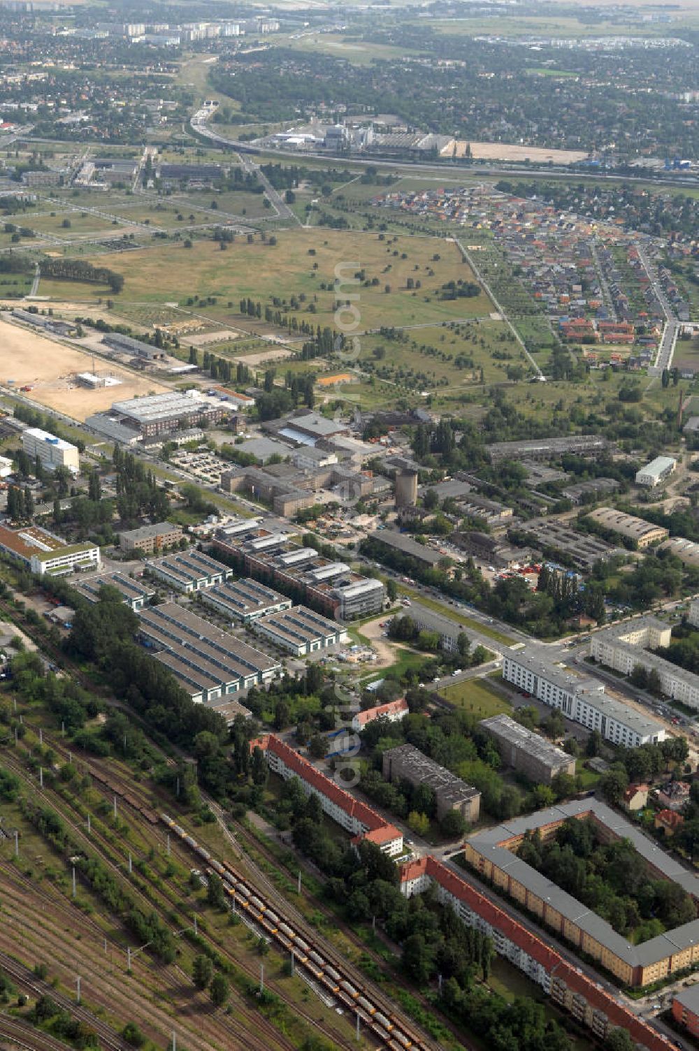 Berlin from the bird's eye view: Blick auf das Wohn- und Industriegebiet an der Bahntrasse Niederschöneweide im Bereich der Landfliegerstrasse, Pilotenstraße, Hagedornstraße und Groß-Berliner Damm. Eine Immobilie der HVB Immobilien AG