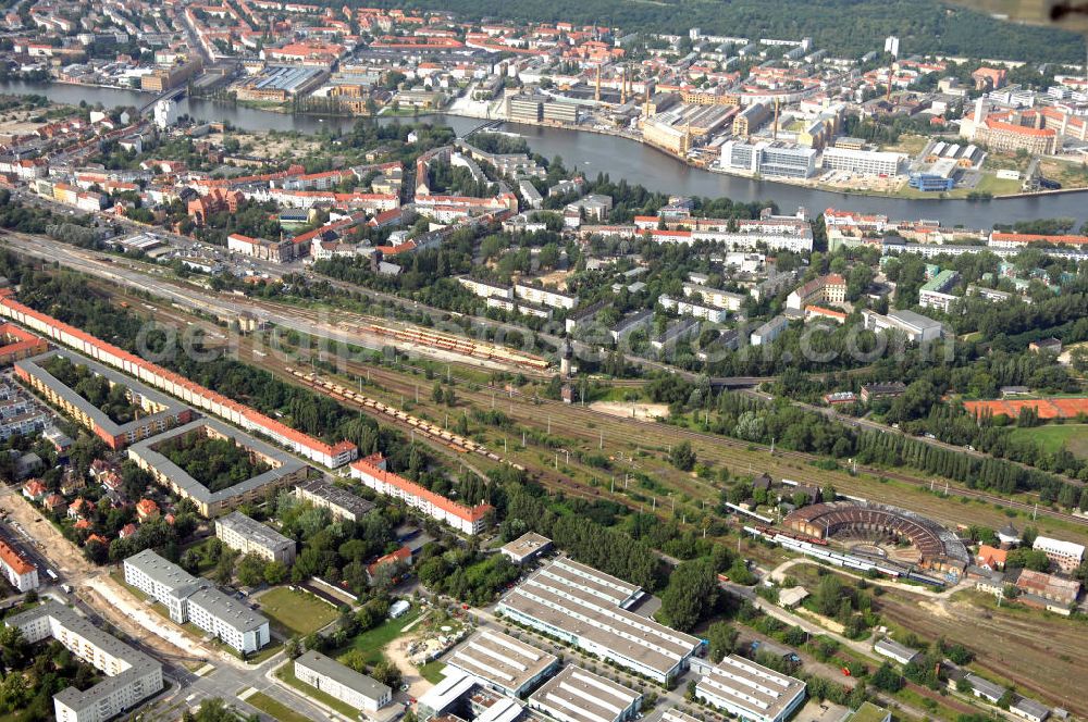 Aerial photograph Berlin - Blick auf das Wohn- und Industriegebiet an der Bahntrasse Niederschöneweide im Bereich der Landfliegerstrasse, Pilotenstraße, Hagedornstraße und Groß-Berliner Damm. Eine Immobilie der HVB Immobilien AG